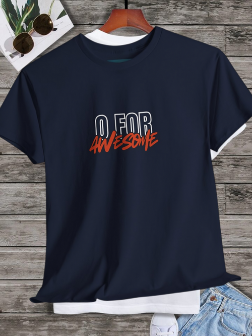 Navy blue t-shirt with 'O FOR AWESOME' text on a wooden surface