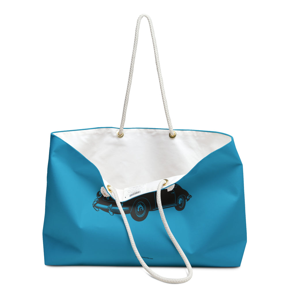 Blue tote bag with a white interior and black porsche 356 car illustration on a white background