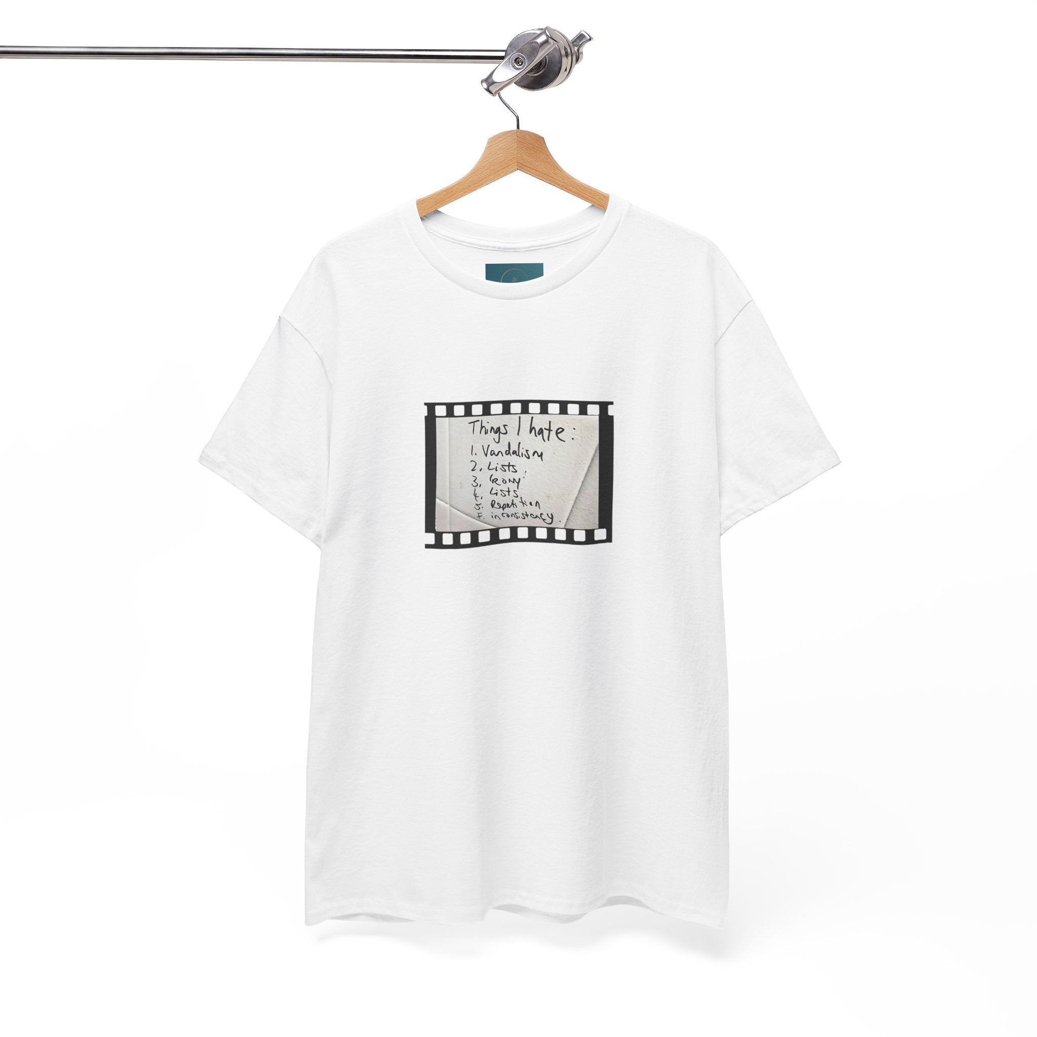 White t-shirt with graphic design on a hanger against a white background