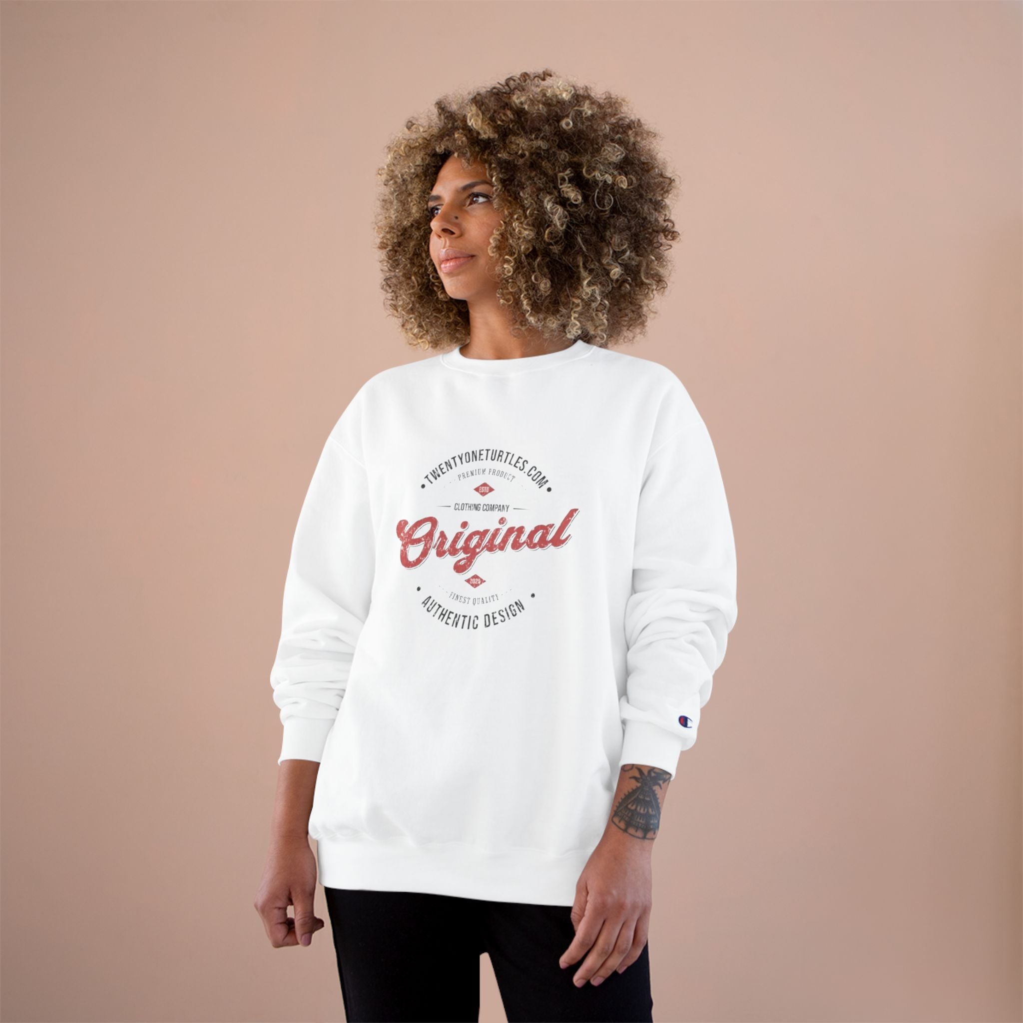 Person wearing a white sweatshirt with red text on a beige background