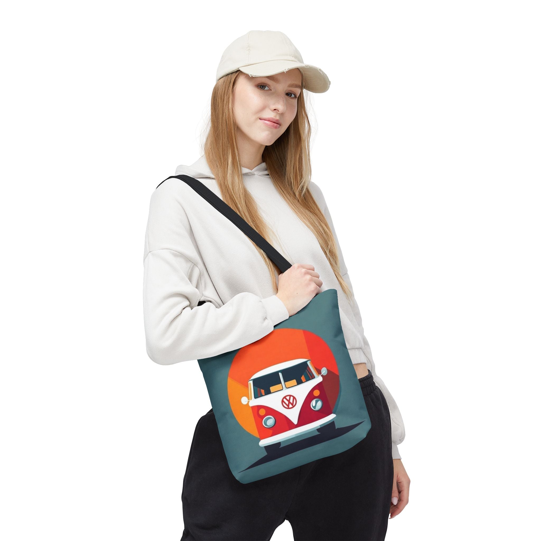 Person wearing a tote bag with a camper van design on a white background