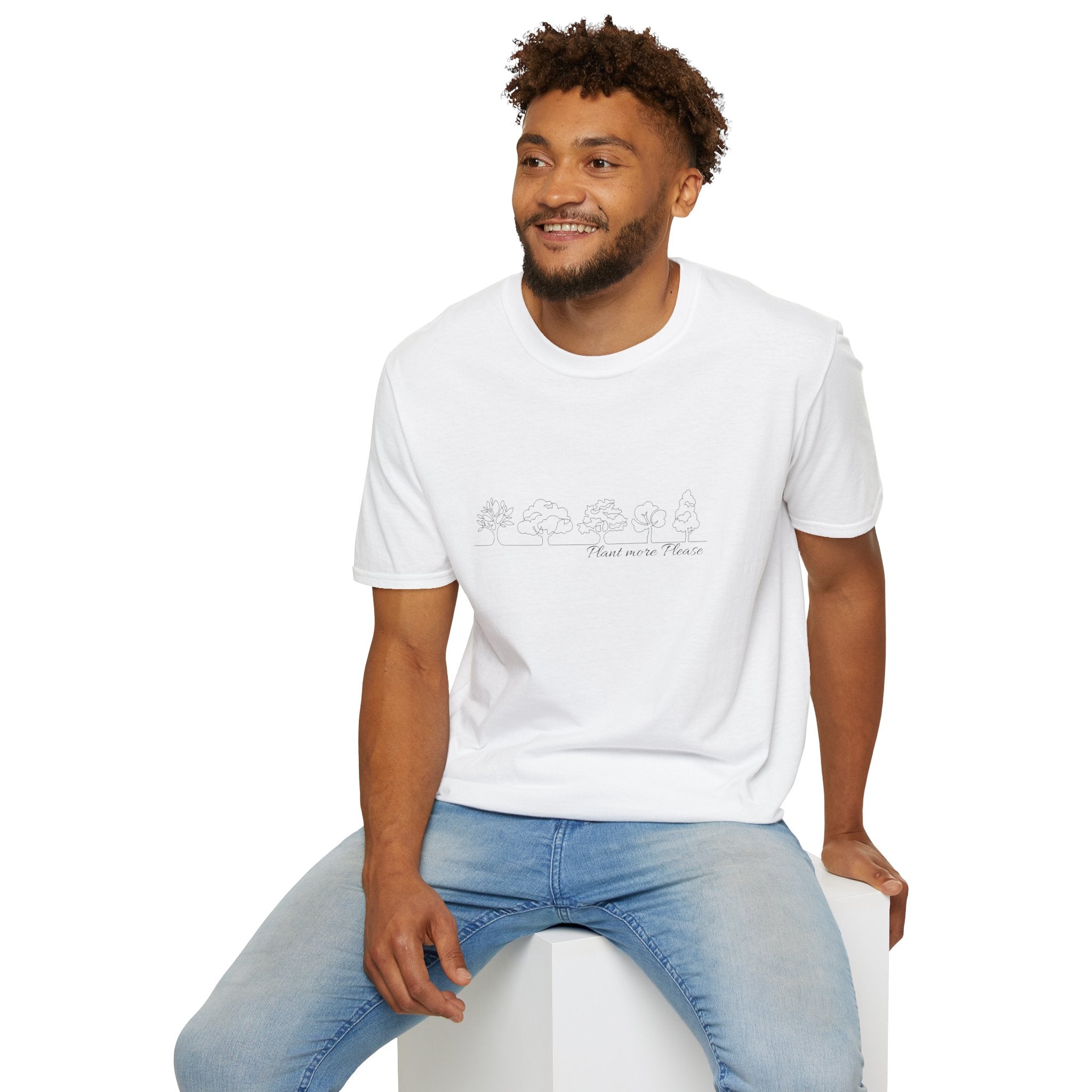 Man wearing a white t-shirt with text and blue jeans sitting on a white stool against a white background