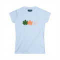 Light blue t-shirt with colorful leaf designs on a white background