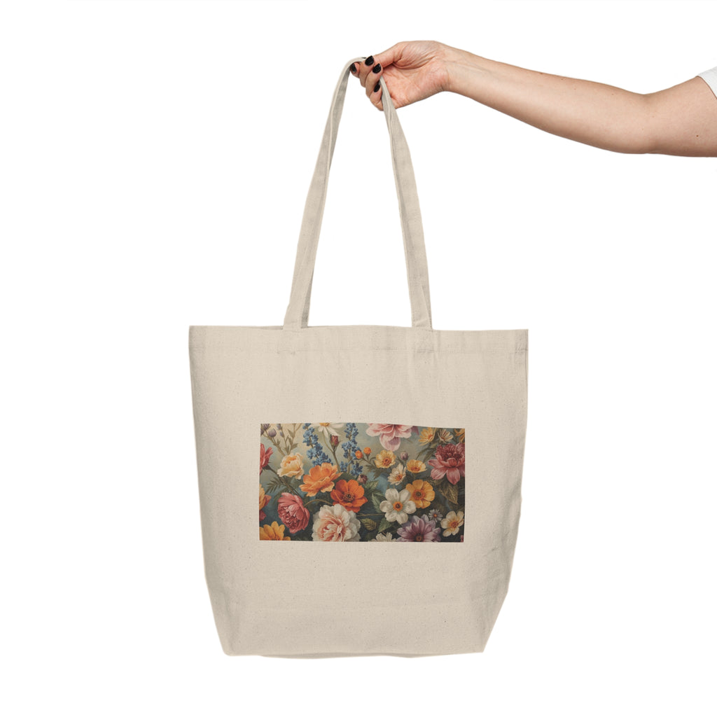Tote bag with floral design held by a hand on a white background