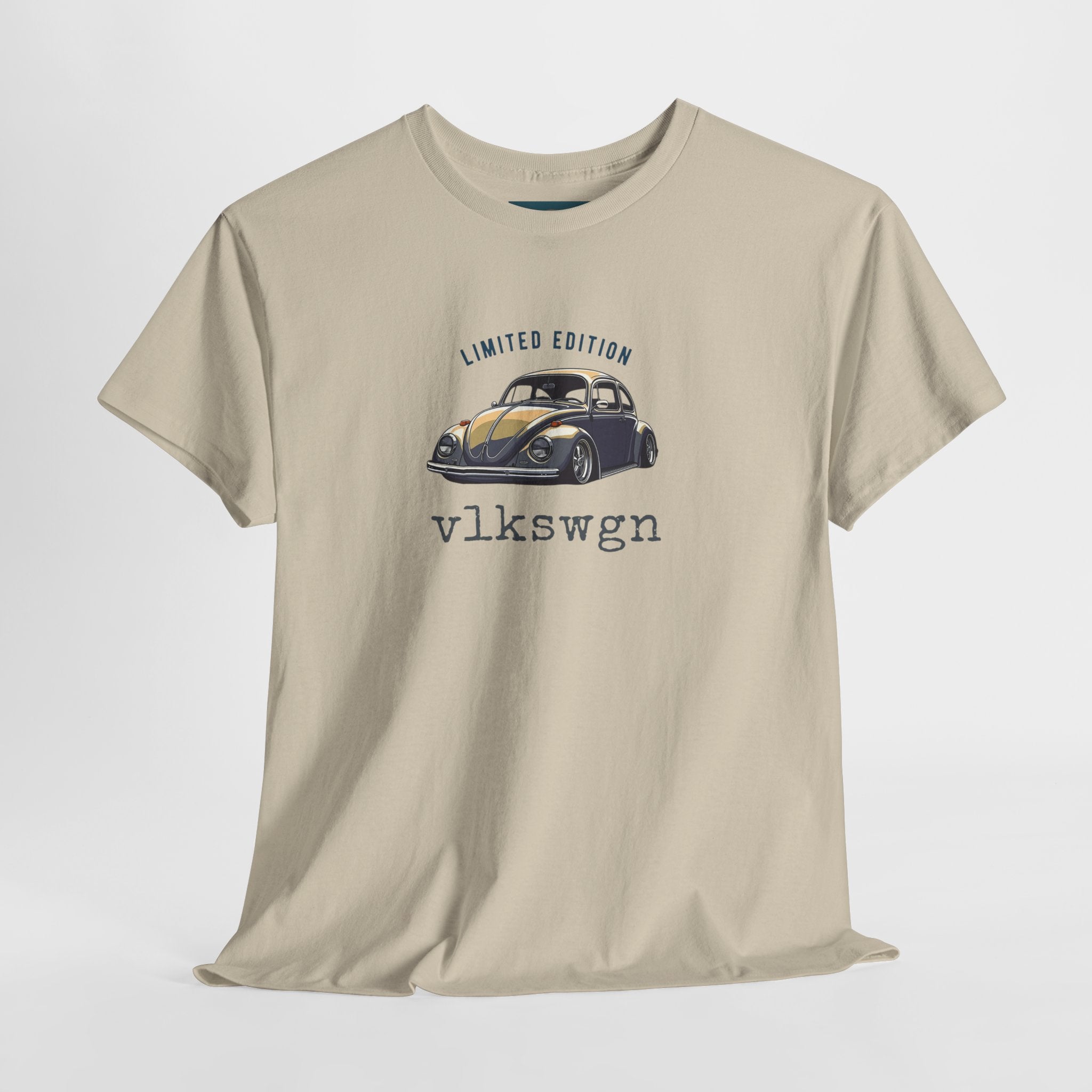 Beige t-shirt with a graphic of a vintage VW Beetle car and text on a white background