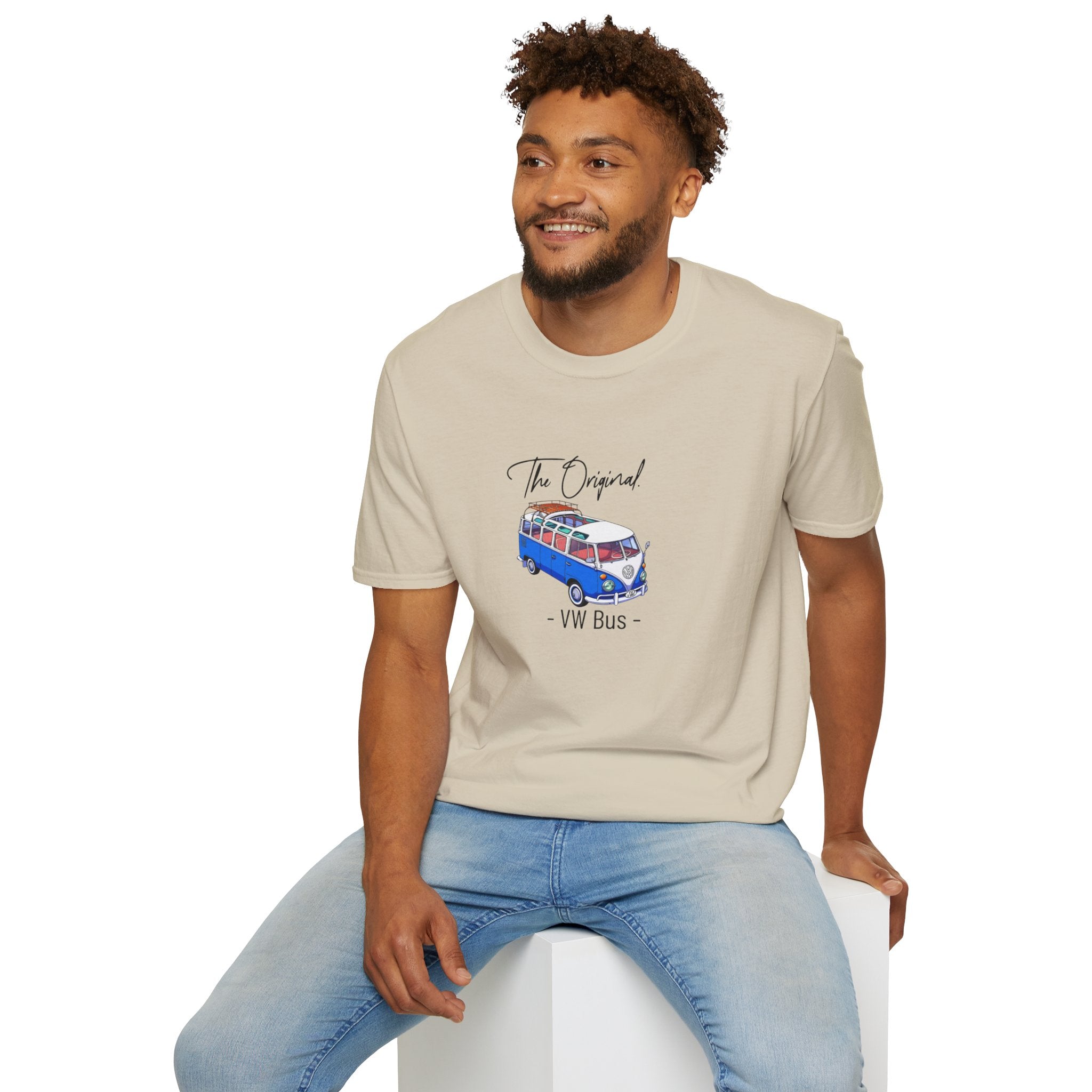 Man wearing a beige t-shirt with a VW bus graphic on a white background