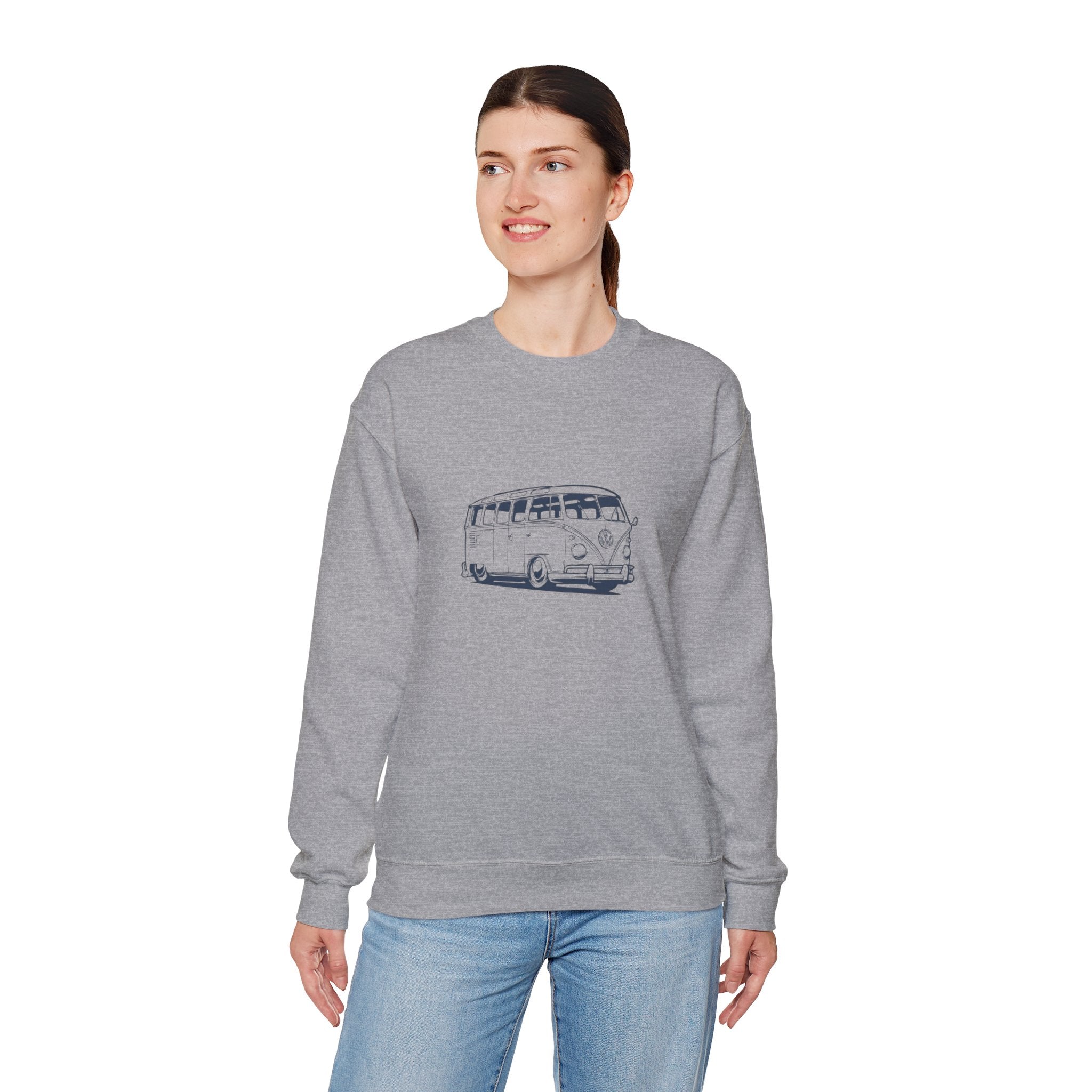 Woman wearing a gray sweatshirt with a graphic vw bus design on a white background