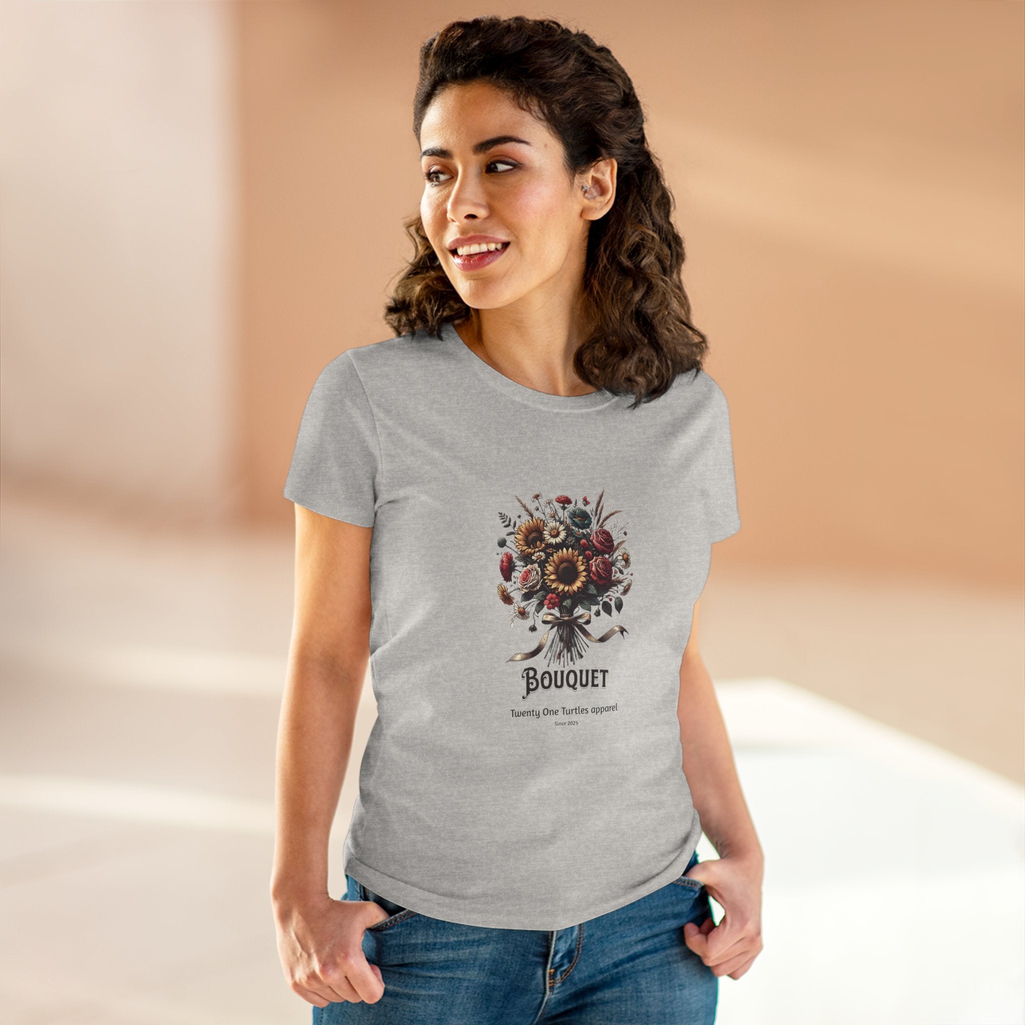 Woman wearing a gray t-shirt with a floral design and 'Bouquet' text on a beige background