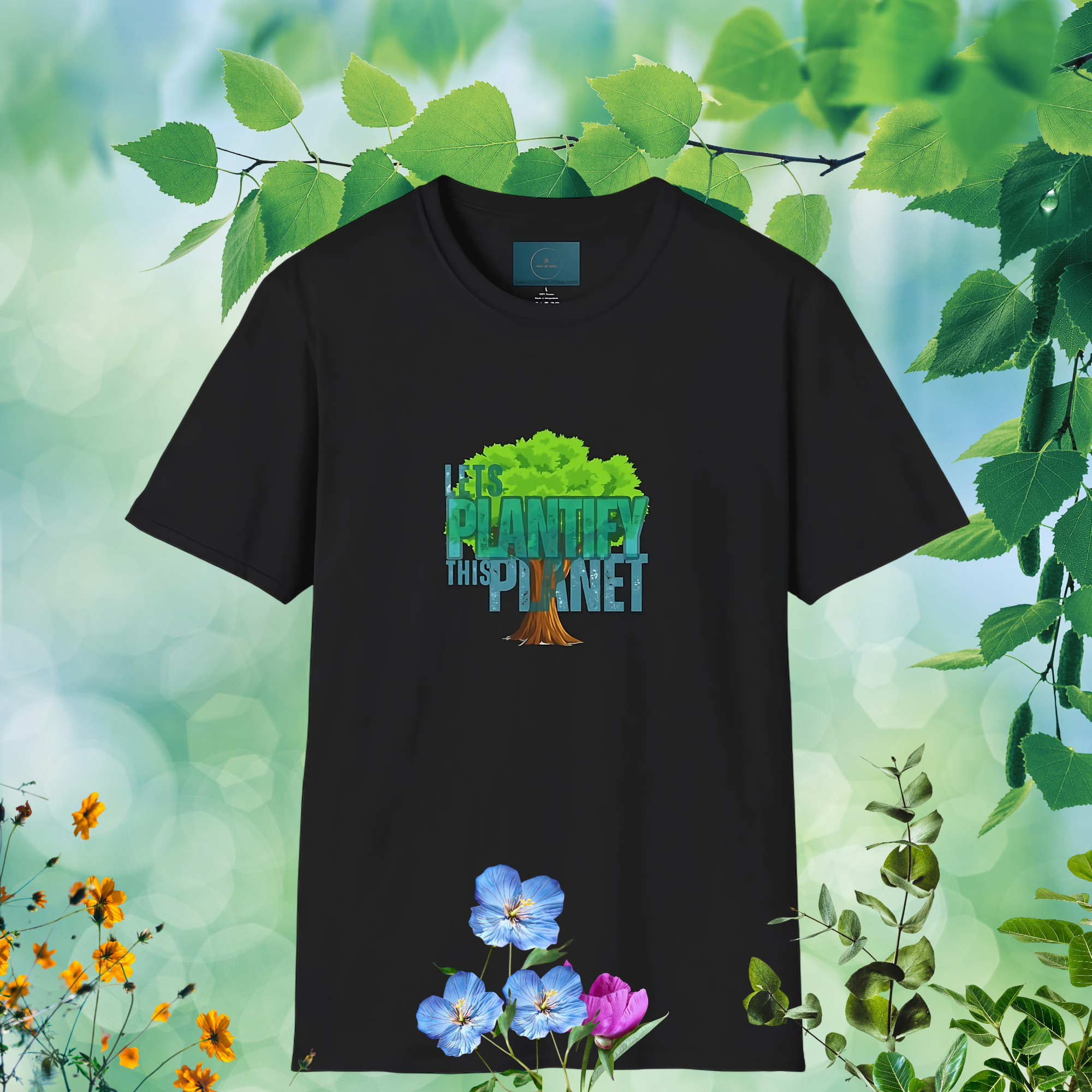 Black t-shirt with a tree graphic and text 'Lets plantify this planet' on a nature-themed background