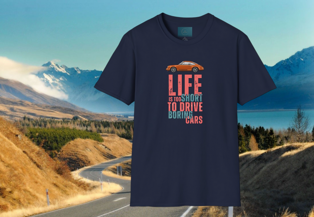 Navy blue t-shirt with a porsche graphic and text over a scenic road and mountain background